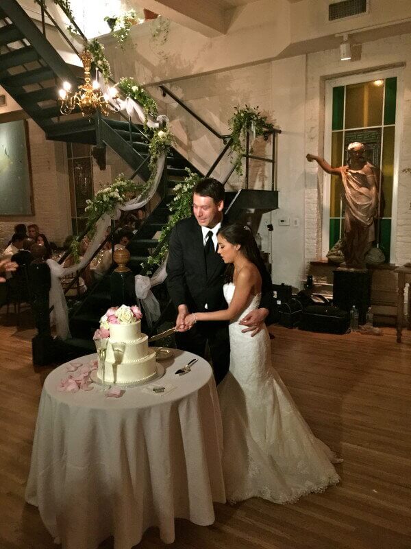 West Village NYC Wedding Bride and Groom cutting Wedding Cake