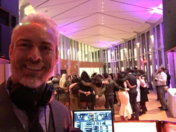 full dance floor behind DJ Greg