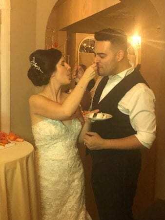 perona farms wedding dj bride feeds cake to groom