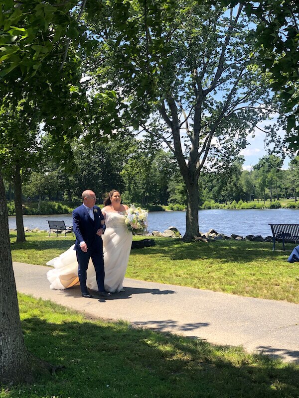 The boathouse at mercer lake in NJ Father walking Bride down aisle by Lake to be married