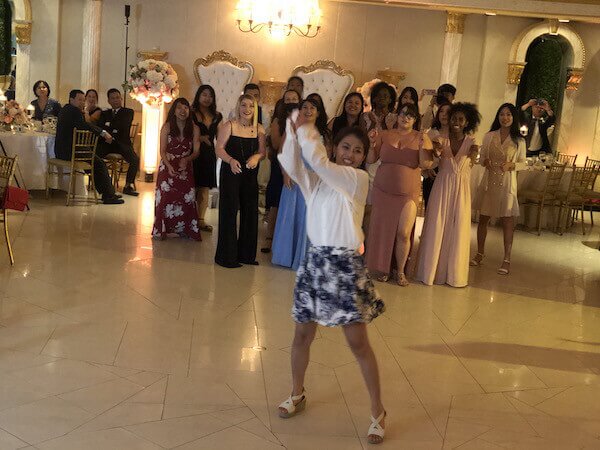 bride throwing bouquet