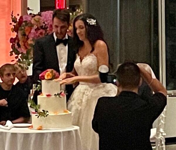 bride and groom cutting cake