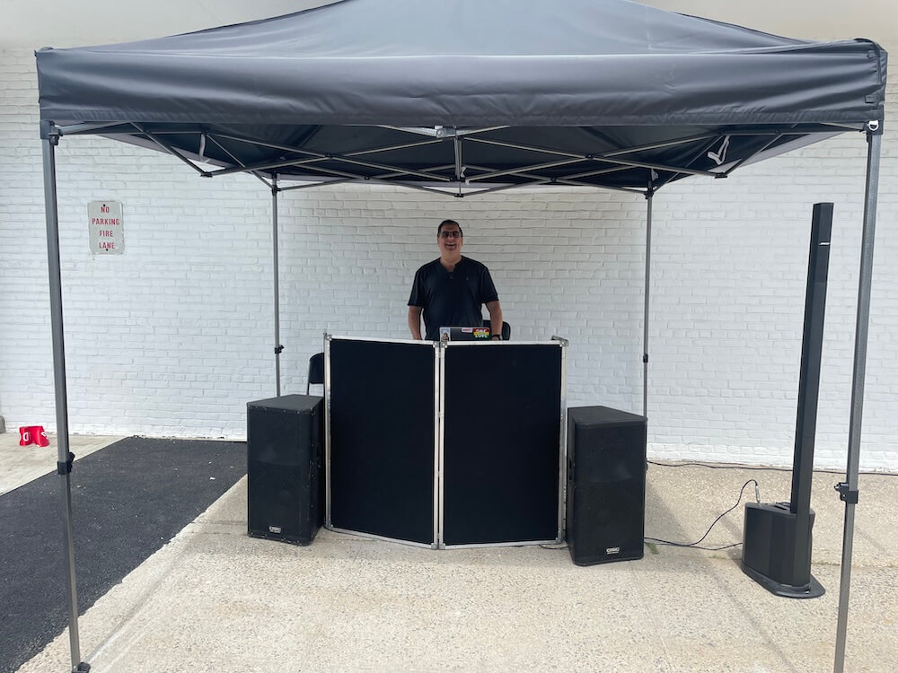 front view of dj dave swirsky dj set up at grand opening saks off fifth